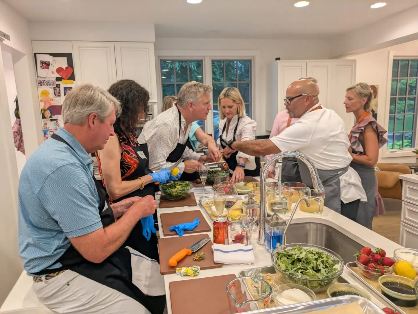 Group cooking class in a kitchen.