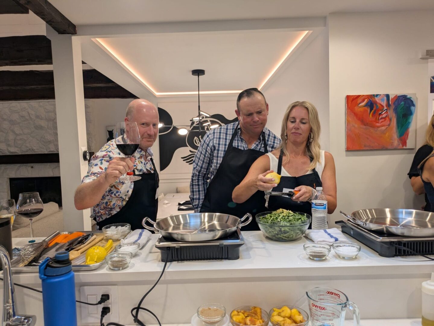 People cooking together in a kitchen.