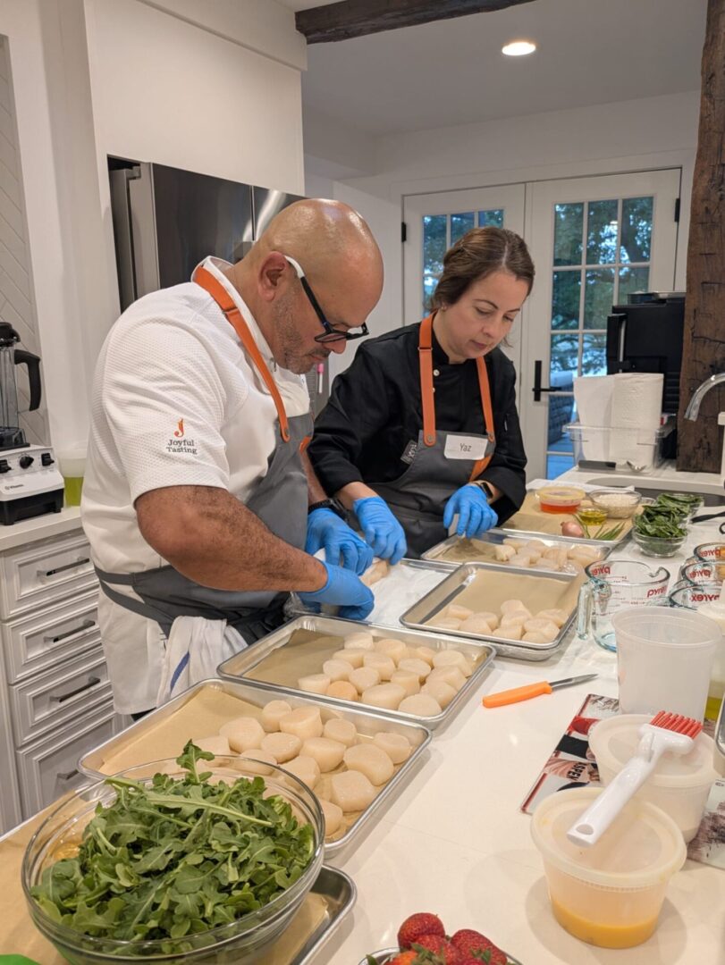 Chefs preparing dough in a kitchen.