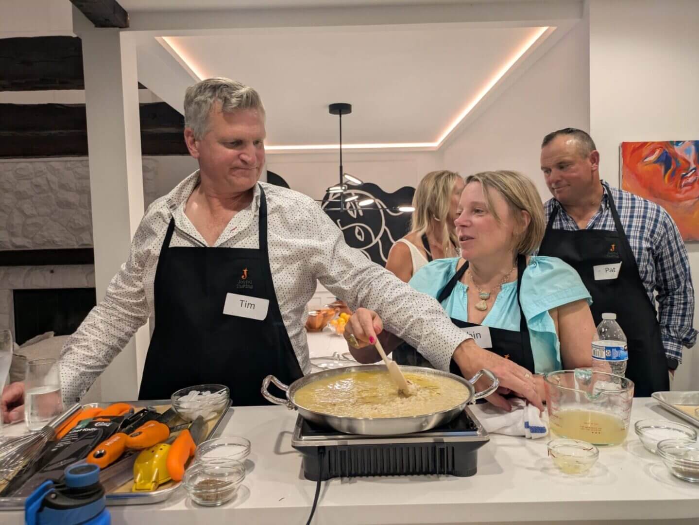 People cooking together in a kitchen.