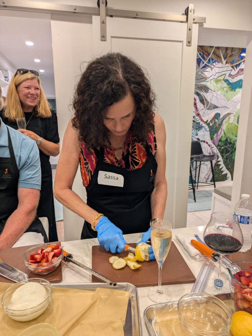 Woman slicing fruit at a cooking class.